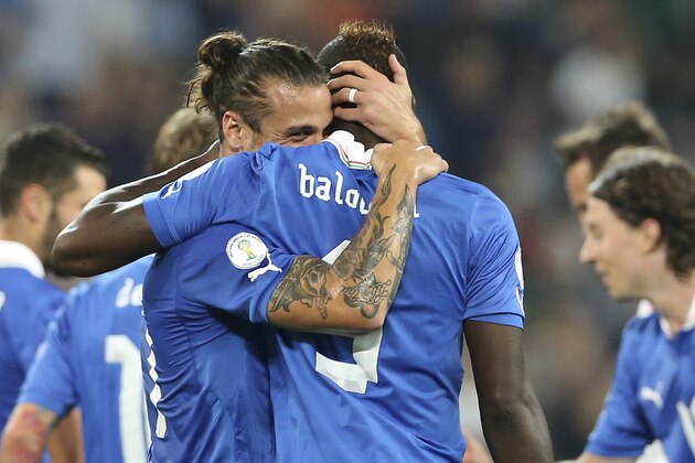 Italy forward Mario Balotelli, right,  celebrates with his teammatePablo Osvaldo after scoring during the 2014 World Cup Group B qualifying soccer match between Italy and Czech Republic at the Juventus stadium in Turin, Italy, Tuesday, Sept. 10, 2013. (AP Photo/Antonio Calanni)