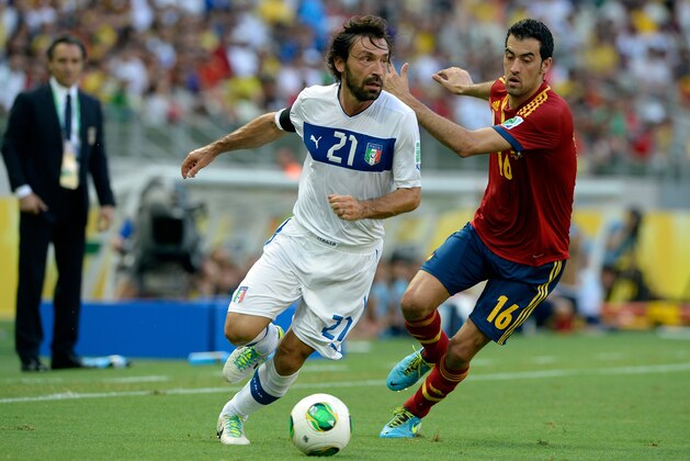 FORTALEZA, BRAZIL - JUNE 27:  Andrea Pirlo of Italy competes with Sergio Busquets of Spain during the FIFA Confederations Cup Brazil 2013 Semi Final match between Spain and Italy at Castelao on June 27, 2013 in Fortaleza, Brazil.  (Photo by Claudio Villa/Getty Images)