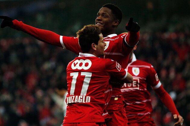 LIEGE, BELGIUM - JANUARY 25:  Michy Batshuayi of Standard is congratulated by team mate Maor Buzaglo after he scores a goal during the Jupiler League match between Standard de Liege and KV Kortrijk at Stade Maurice Dufrasne the on January 25, 2013 in Liege, Belgium.  (Photo by Dean Mouhtaropoulos/Getty Images)