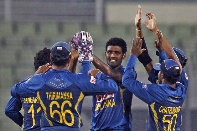 Sri Lanka’s Thisara Perera, center, celebrates with teammates after taking the wicket of Afghanistan’s Nawroz Mangal during the Asia Cup one-day international cricket tournament between them in Dhaka, Bangladesh, Monday, March 3, 2014. (AP Photo/A.M. Ahad) Sri Lanka’s Thisara Perera, center, celebrates with teammates after taking the wicket of Afghanistan’s Nawroz Mangal during the Asia Cup one-day international cricket tournament between them in Dhaka, Bangladesh, Monday, March 3, 2014. (AP Photo/A.M. Ahad)
