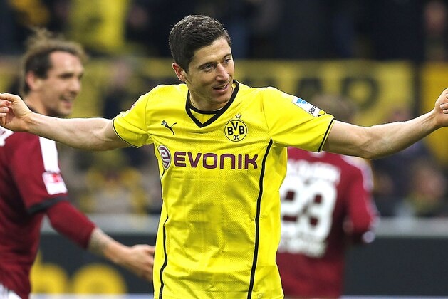 Dortmund's Robert Lewandowski of Poland celebrates after scoring  during the German first division Bundesliga soccer match between BvB Borussia Dortmund and 1.FC Nuremberg in Dortmund, Germany, Saturday, March 1, 2014.  (AP Photo/Frank Augstein)