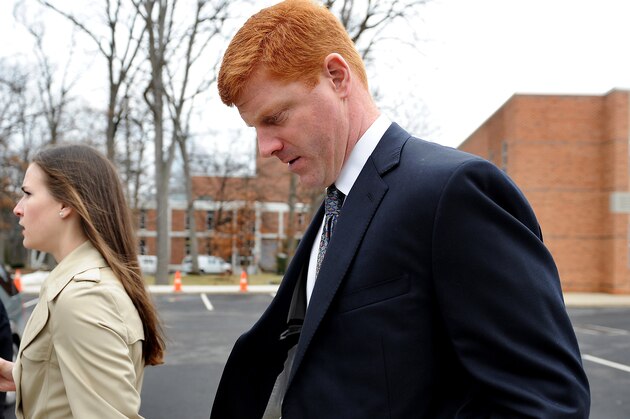 STATE COLLEGE, PA - JANUARY 24: Former Penn State assistant coach Mike McQueary walks outside after paying respect to former Penn State Football coach Joe Paterno during a public viewing at the Pasquerilla Spiritual Center on the campus of Penn State on January 24, 2012 in State College, Pennsylvania. Paterno, who was 85, died due to complications from lung cancer on January 22, 2012. (Photo by Patrick Smith/Getty Images)