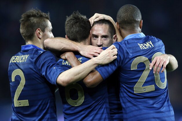 France's Franck Ribery, second right, reacts with team mates , from left Mathieu Debuchy, Yohan Cabaye, and Loic Remy after Yohan Cabaye scored the fourth goal against Australia during their international soccer friendly match between France and Australia at the Parc Des Princes stadium in Paris, France, Friday, Oct.11, 2013. (AP Photo/Francois Mori)