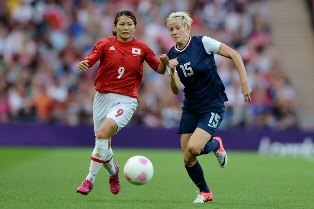 LONDON, ENGLAND - AUGUST 09:  Megan Rapinoe #15 of United States and Nahomi Kawasumi #9 of Japan go for the ball during the Women's Football gold medal match on Day 13 of the London 2012 Olympic Games at Wembley Stadium on August 9, 2012 in London, England.  (Photo by Michael Regan/Getty Images)