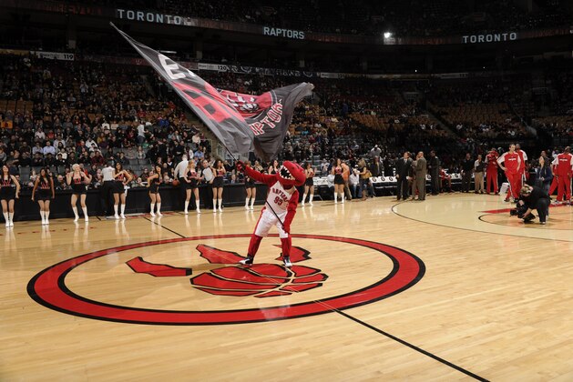 TORONTO, CANADA - FEBRUARY 11:  A Mascot of the Toronto Raptors waves the flag during the game against the Portland Trail Blazers on February 11, 2011 at the Air Canada Centre in Toronto, Ontario, Canada.  The Trail Blazers won 102-96. NOTE TO USER: User expressly acknowledges and agrees that, by downloading and or using this Photograph, user is consenting to the terms and conditions of the Getty Images License Agreement.  Mandatory Copyright Notice: Copyright 2011 NBAE (Photo by Ron Turenne/NBAE via Getty Images)