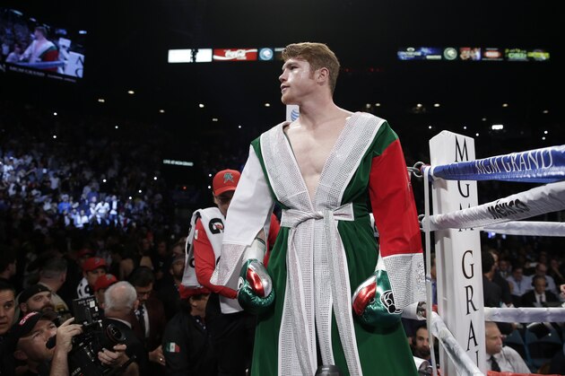 Canelo Alvarez prepares to step into the ring for a 152-pound title fight against Floyd Mayweather Jr., Saturday, Sept. 14, 2013, in Las Vegas. (AP Photo/Eric Jamison)