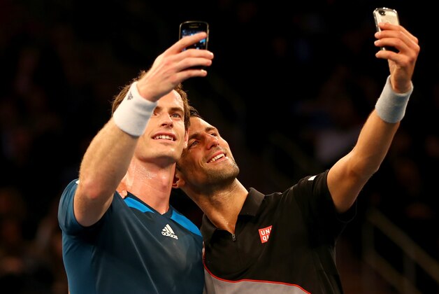 NEW YORK, NY - MARCH 03:  Andy Murray of Great Britain and Novak Djokovic of Serbia take selfies with their phones during the BNP Paribas Showdown at Madison Square Garden on March 3, 2014 in New York City.  (Photo by Elsa/Getty Images)