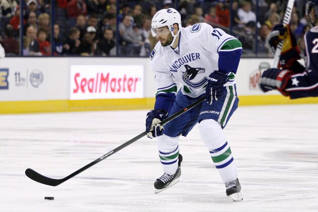 Vancouver's Ryan Kesler moves the puck against Columbus during the first period of an NHL hockey game Sunday, Oct. 20, 2013, in Columbus, Ohio. (AP Photo/ Mike Munden)