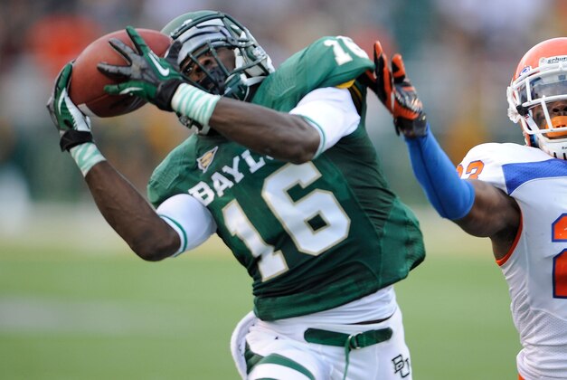Sep 15, 2012; Waco, TX, USA; Baylor Bears wide receiver Tevin Reese (16) makes a catch as Sam Houston State Bearkats defensive back Robert Shaw (23) defends during the first quarter at Floyd Casey Stadium. Mandatory Credit: Jerome Miron-USA TODAY Sports