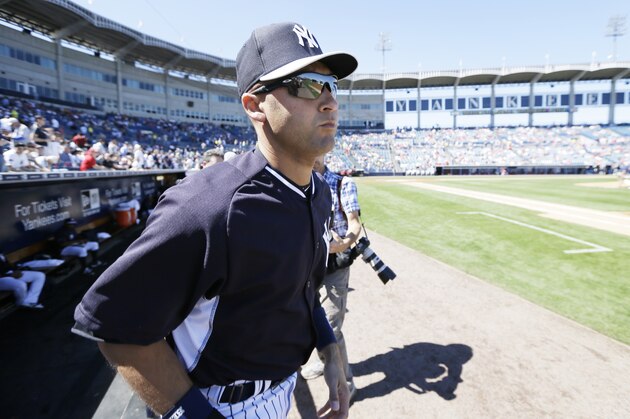New York Yankees shortstop Derek Jeter runs out of the dugout before an exhibition baseball game against the Philadelphia Phillies Saturday, March 1, 2014, in Tampa, Fla. (AP Photo/Charlie Neibergall)