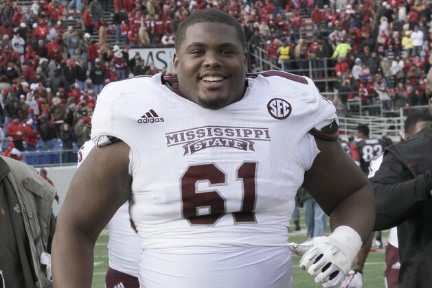 Mississippi State offensive linesman Gabe Jackson leaves the field after overtime in an NCAA college football game in Little Rock, Ark., Saturday, Nov. 23, 2013. Mississippi State defeated Arkansas 24-17 in overtime. (AP Photo/Danny Johnston)