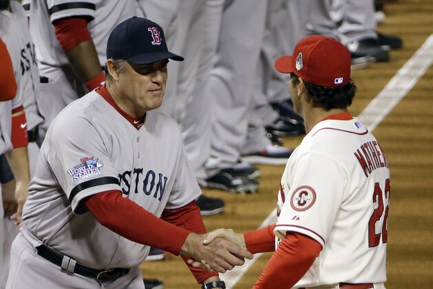 Boston Red Sox manager John Farrell shakes hands with St. Louis Cardinals manager Mike Matheny before Game 3 of baseball's World Series Saturday, Oct. 26, 2013, in St. Louis. (AP Photo/David J. Phillip)
