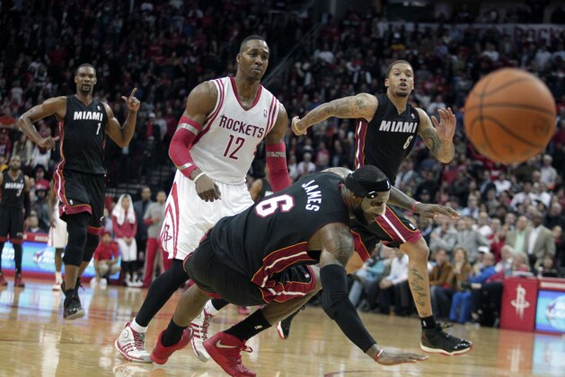 Miami Heat forward LeBron James (6) falls to the ground after colliding with Houston Rockets center Dwight Howard (12) during the fourth quarter of an NBA basketball game, Tuesday, March, 4, 2014, in Houston. The Rockets defeated the Heat 106-103. (AP Photo/Patric Schneider) Miami Heat forward LeBron James (6) falls to the ground after colliding with Houston Rockets center Dwight Howard (12) during the fourth quarter of an NBA basketball game, Tuesday, March, 4, 2014, in Houston. The Rockets defeated the Heat 106-103. (AP Photo/Patric Schneider)