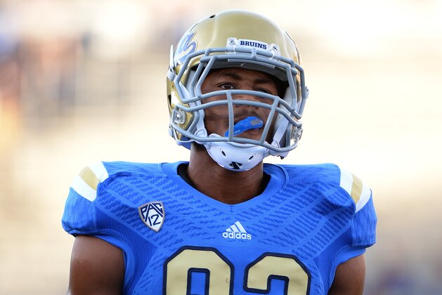 PASADENA, CA - AUGUST 31:  Eldridge Massington #82 of the UCLA Bruins warms up before the game against the Nevada Wolf Pack at Rose Bowl on August 31, 2013 in Pasadena, California.  (Photo by Harry How/Getty Images)