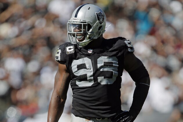 OAKLAND, CA - SEPTEMBER 15:  Defensive end Lamarr Houston #99 of the Oakland Raiders waits for the call from the sidelines against the Jacksonville Jaguars in the third quarter on September 15, 2013 at O.co Coliseum in Oakland, California.  The Raiders won 19-9. (Photo by Brian Bahr/Getty Images)
