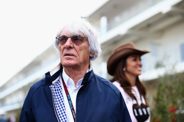 AUSTIN, TX - NOVEMBER 14:  F1 supremo Bernie Ecclestone and his wife Fabiana Flosi arrive in the paddock during previews to the United States Formula One Grand Prix at Circuit of The Americas on November 14, 2013 in Austin, United States.  (Photo by Paul Gilham/Getty Images)