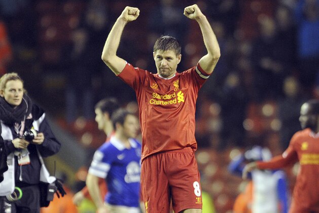 Liverpool's Steven Gerrard celebrates his side's victory at the end of the game during their English Premier League soccer match against Everton at Anfield in Liverpool, England, Tuesday Jan. 28, 2014. (AP Photo/Clint Hughes)