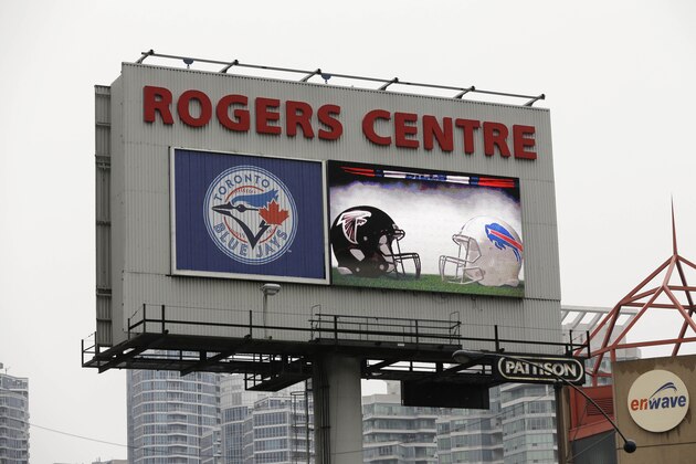 A sign advertises an NFL football game between the Atlanta Falcons and the Buffalo Bills on Sunday, Dec. 1, 2013, in Toronto. (AP Photo/Mike Groll)