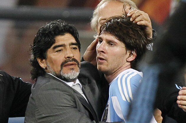 Argentina's Lionel Messi, right, is comforted by Argentina head coach Diego Maradona, left, following the World Cup quarterfinal soccer match between Argentina and Germany at the Green Point stadium in Cape Town, South Africa, Saturday, July 3, 2010. Germany won 4-0.  (AP Photo/Ricardo Mazalan)