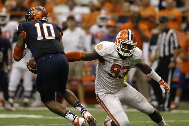 Clemson defensive end Corey Crawford (93) pressures Syracuse quarterback Terrell Hunt (10) during the second half of an NCAA college football game on Saturday, Oct. 5, 2013, in Syracuse, N.Y. Clemson won, 49-14. (AP Photo/Mike Groll)