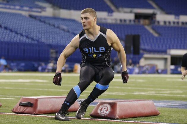 Montana linebacker Jordan Tripp runs a drill at the NFL football scouting combine in Indianapolis, Monday, Feb. 24, 2014. (AP Photo/Michael Conroy)