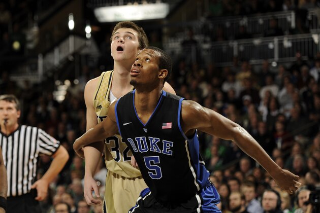 Duke guard Rodney Hood battles for rebounding position with Notre Dame guard Steve Vasturia in an NCAA college basketball game Saturday Jan. 4 , 2014 in South Bend, Ind. (AP Photo/Joe Raymond)