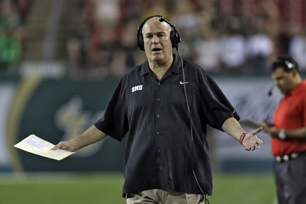 SMU head coach June Jones gestures to a referee during the third quarter of an NCAA college football game against South Florida Saturday, Nov. 23, 2013, in Tampa, Fla. SMU won the game 16-6. (AP Photo/Chris O'Meara)