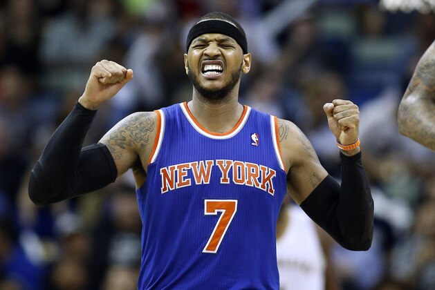 New York Knicks small forward Carmelo Anthony (7) celebrates after scoring during the second half of an NBA basketball game against the New Orleans Pelicans in New Orleans, Wednesday, Feb. 19, 2014. The Knicks won 98-91. (AP Photo/Jonathan Bachman)