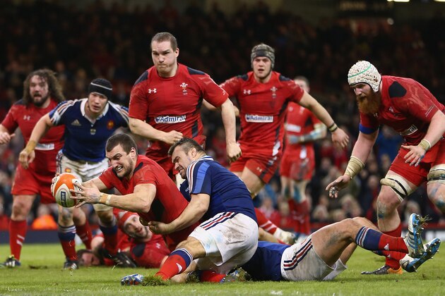 CARDIFF, WALES - FEBRUARY 21:  (EDITORS NOTE: THIS PICTURE IS A RECROP OF IMAGE 474015723) Sam Warburton of Wales scores a try as Nicolas Mas of fails to hold him up during the RBS Six Nations match between Wales and France at the Millennium Stadium on February 21, 2014 in Cardiff, Wales.  (Photo by Michael Steele/Getty Images)