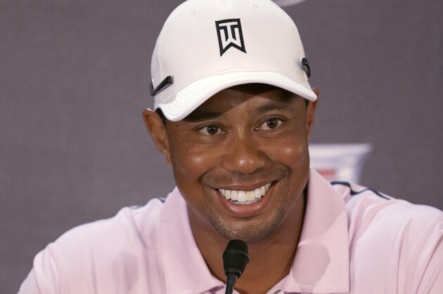 Golfer Tiger Woods smiles at a news conference before a practice round of the Cadillac Championship golf tournament, Wednesday, March 5, 2014 in Doral, Fla. Three days after he withdrew in the middle of the final round at the Honda Classic with lower back pain, Woods returned to work at the Cadillac Championship by saying he feels better after a few days of constant treatment, and that he was good enough to try to defend his title. (AP Photo/Wilfredo Lee) Golfer Tiger Woods smiles at a news conference before a practice round of the Cadillac Championship golf tournament, Wednesday, March 5, 2014 in Doral, Fla. Three days after he withdrew in the middle of the final round at the Honda Classic with lower back pain, Woods returned to work at the Cadillac Championship by saying he feels better after a few days of constant treatment, and that he was good enough to try to defend his title. (AP Photo/Wilfredo Lee)