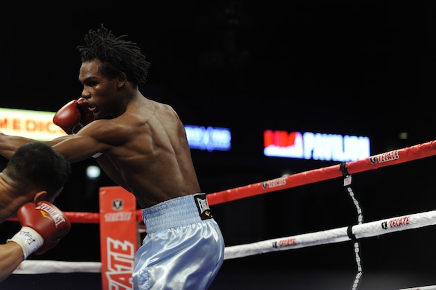 Jermall Charlo right, fights Adon Lozano in a NABO match in Chicago, Saturday Dec. 12, 2009. (AP Photo/Paul Beaty)
