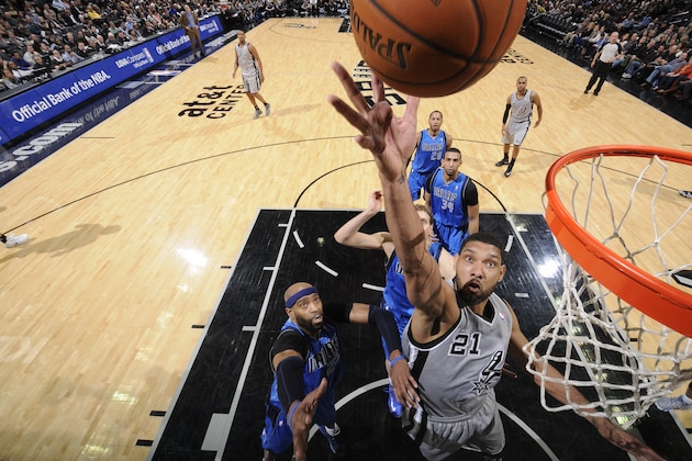 SAN ANTONIO, TX - March 2: Tim Duncan #21 of the San Antonio Spurs takes a shot during a game against the Dallas Mavericks at the AT&T Center on March 2, 2014 in San Antonio, Texas. NOTE TO USER: User expressly acknowledges and agrees that, by downloading and or using this photograph, user is consenting to the terms and conditions of the Getty Images License Agreement. Mandatory Copyright Notice: Copyright 2014 NBAE (Photos by D. Clarke Evans/NBAE via Getty Images)