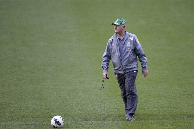 Brazil's coach Luiz Felipe Scolari walks around the stadium before a training session at Seoul World Cup Stadium in Seoul, South Korea, Friday, Oct. 11, 2013. Brazil's national soccer team will play a friendly soccer game against South Korea on Saturday, Oct. 12, in Seoul. (AP Photo/Lee Jin-man)