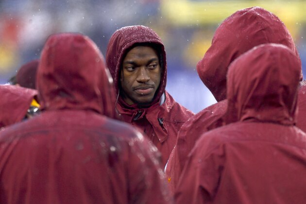 EAST RUTHERFORD, NJ - DECEMBER 29:   Robert Griffin III #10 of the Washington Redskins stands on the sidelines during their game against the New York Giants at MetLife Stadium on December 29, 2013 in East Rutherford, New Jersey.  (Photo by Jeff Zelevansky/Getty Images)