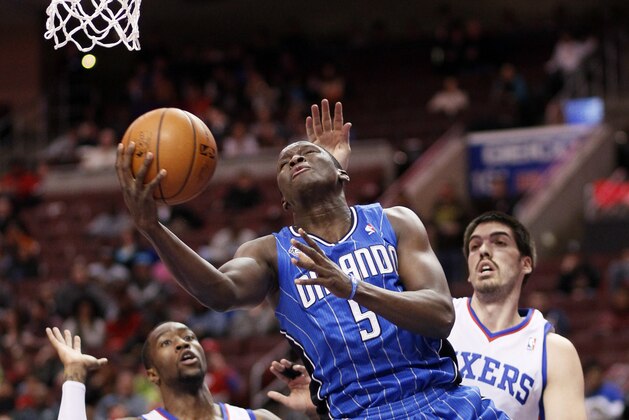 Orlando Magic's Victor Oladipo, center, drives in for a layup between Philadelphia 76ers' Tony Wroten, left, and Byron Mullens, right, during the first half of an NBA basketball game on Wednesday, Feb 26, 2014, in Philadelphia. (AP Photo/Tom Mihalek) Orlando Magic's Victor Oladipo, center, drives in for a layup between Philadelphia 76ers' Tony Wroten, left, and Byron Mullens, right, during the first half of an NBA basketball game on Wednesday, Feb 26, 2014, in Philadelphia. (AP Photo/Tom Mihalek)