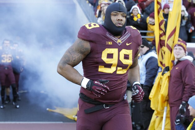 Minnesota defensive lineman Ra'Shede Hageman (99) takes the field prior to an NCAA college football game against Wisconsin in Minneapolis Saturday, Nov. 23, 2013. (AP Photo/Ann Heisenfelt)