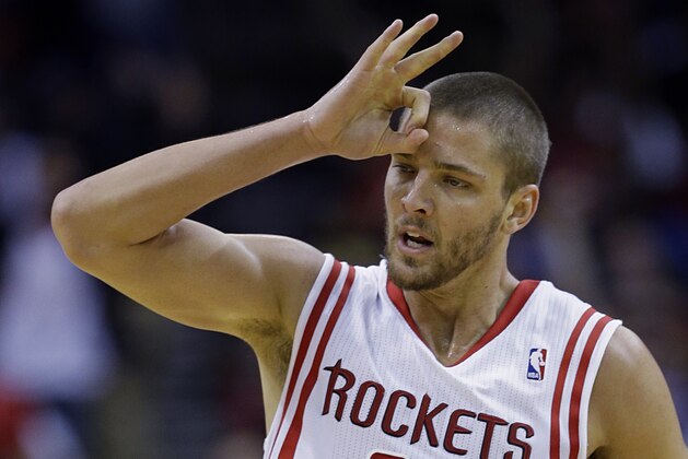 Houston Rockets' Chandler Parsons (25) celebrates his three-point basket against the Oklahoma City Thunder during the second quarter of an NBA basketball game, Thursday, Jan. 16, 2014, in Houston. (AP Photo/David J. Phillip)