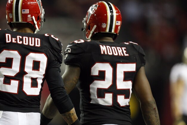 Nov 29, 2012; Atlanta, GA, USA; Atlanta Falcons free safety Thomas DeCoud (28) congratulates strong safety William Moore (25) after Moore made an interception during the second half against the New Orleans Saints at the Georgia Dome. The Falcons defeated the Saints 23-13. Mandatory Credit: Josh D. Weiss-USA TODAY Sports