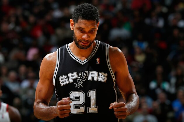 ATLANTA, GA - JANUARY 24:  Tim Duncan #21 of the San Antonio Spurs reacts after a basket against the Atlanta Hawks at Philips Arena on January 24, 2014 in Atlanta, Georgia.  NOTE TO USER: User expressly acknowledges and agrees that, by downloading and or using this photograph, User is consenting to the terms and conditions of the Getty Images License Agreement.  (Photo by Kevin C. Cox/Getty Images)