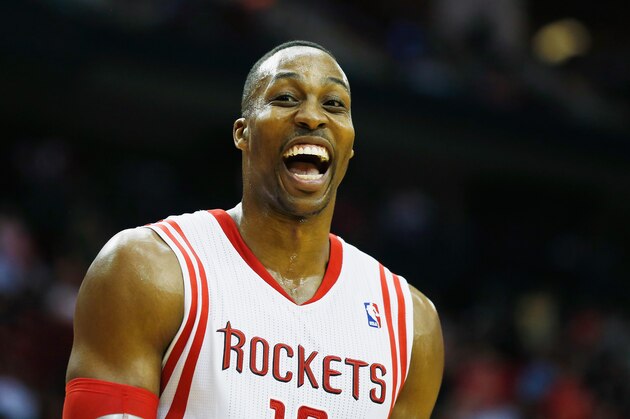 HOUSTON, TX - MARCH 01:  Dwight Howard #12 of the Houston Rockets walks across the court during the game against the Detroit Pistons at the Toyota Center on March 1, 2014 in Houston, Texas. NOTE TO USER: User expressly acknowledges and agrees that, by downloading and or using this photograph, User is consenting to the terms and conditions of the Getty Images License Agreement.  (Photo by Scott Halleran/Getty Images)