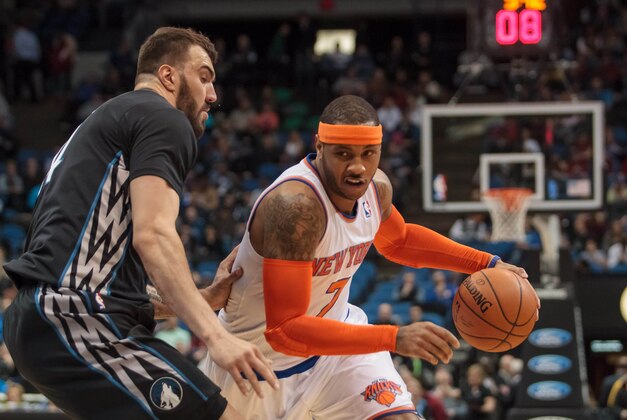 Mar 5, 2014; Minneapolis, MN, USA; New York Knicks forward Carmelo Anthony (7) dribbles in the first quarter against the Minnesota Timberwolves center Nikola Pekovic (14) at Target Center. Mandatory Credit: Brad Rempel-USA TODAY Sports