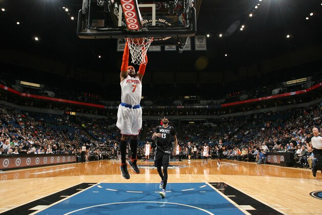 MINNEAPOLIS, MN - MARCH 5: Carmelo Anthony #7 of the New York Knicks dunks against the Minnesota Timberwolves on March 5, 2014 at Target Center in Minneapolis, Minnesota. NOTE TO USER: User expressly acknowledges and agrees that, by downloading and or using this Photograph, user is consenting to the terms and conditions of the Getty Images License Agreement. Mandatory Copyright Notice: Copyright 2014 NBAE (Photo by David Sherman/NBAE via Getty Images)