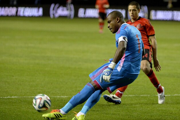 Nigeria goalie Vincent Enyeama (1) blocks in front of Mexico's Javier Hernandez during the first half of an international friendly soccer match Wednesday, March 5, 2014, in Atlanta. (AP Photo/David Tulis)
