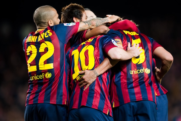 BARCELONA, SPAIN - MARCH 02: Players of FC Barcelona celebrate after Carles Puyol scored his team's third goal during the La Liga match between FC Barcelona and UD Almeria at Camp Nou on March 2, 2014 in Barcelona, Spain.  (Photo by Alex Caparros/Getty Images)