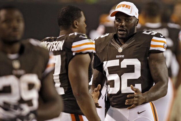 Cleveland Browns linebacker D'Qwell Jackson (52) talks to Craig Robertson on the sidelines during a preseason NFL football game against the Chicago Bears Thursday, Aug. 30, 2012, in Cleveland. (AP Photo/Mark Duncan)