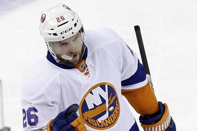 New York Islanders' Thomas Vanek (26) skates back toward his bench after scoring during the third period of an NHL hockey game against the New York Rangers, Tuesday, Jan. 21, 2014, in New York. The Islanders won the game 5-3. (AP Photo/Frank Franklin II)