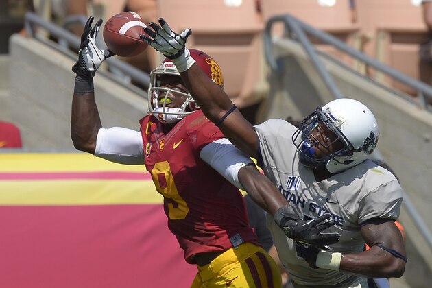 Southern California wide receiver Marqise Lee, left, cannot hold on to a pass in the end zone as Utah State cornerback Nevin Lawson defends the first half of an NCAA college football game on Saturday, Sept. 21, 2013, in Los Angeles. (AP Photo/Mark J. Terrill)