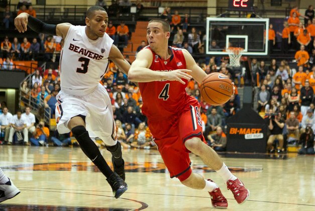 Mar 5, 2014; Corvallis, OR, USA;  Arizona Wildcats guard T.J. McConnell (4) drives to the basket against Oregon State Beavers guard Hallice Cooke (3) in the first half at Gill Coliseum. Mandatory Credit: Jaime Valdez-USA TODAY Sports
