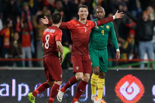 Portugal's Cristiano Ronaldo celebrates after scoring his second goal during their friendly soccer match with Cameroon Wednesday, March 5 2014, in Leiria, Portugal. The game is part of both teams' preparation for the World Cup in Brazil. (AP Photo/Armando Franca)
