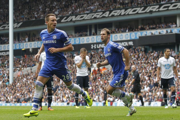 Chelsea's John Terry, left, celebrates his goal against Tottenham Hotspur with teammate Branislav Ivanovic during their English Premier League soccer match at White Hart Lane, London, Saturday, Sept. 28, 2013. (AP Photo/Sang Tan)